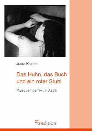 Das Huhn, das Buch und ein roter Stuhl