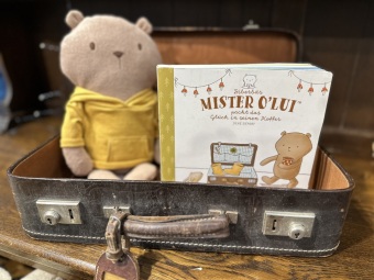 Mister O'Lui packt das Glück in seinen Koffer
